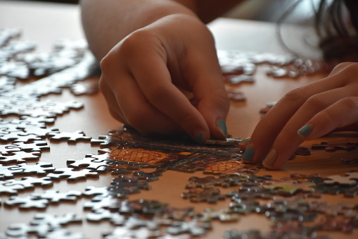 A girl makes a puzzle