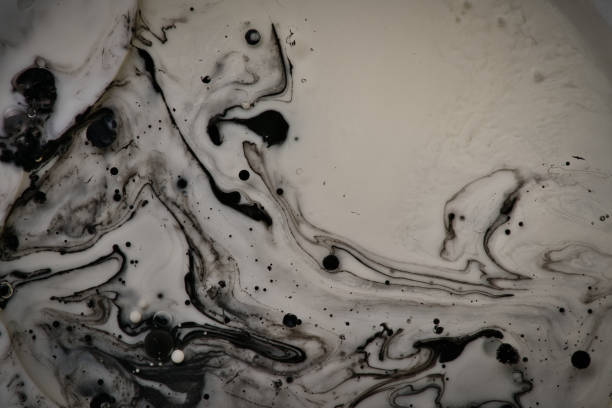 istock mixing black and white color paints 1174689465