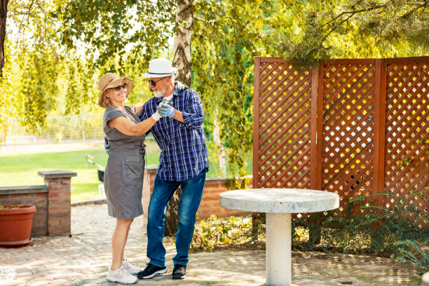 istock Active senior couple dancing together in the garden 1174690051