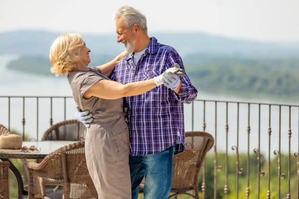 istock Active senior couple dancing together in the garden 1174690298