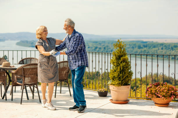 istock Active senior couple dancing together in the garden 1174690355