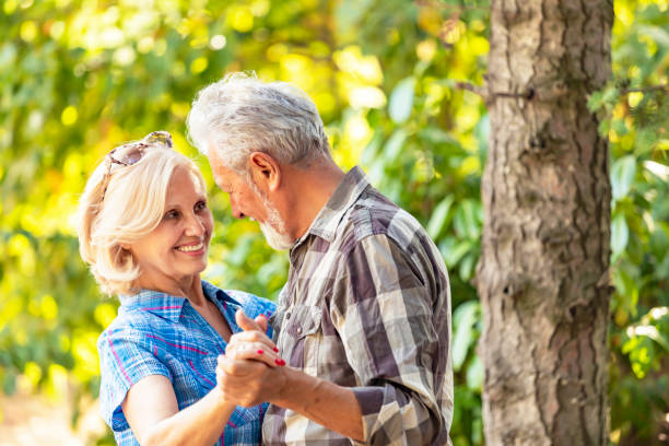 istock Active senior couple dancing together in the garden 1174690419