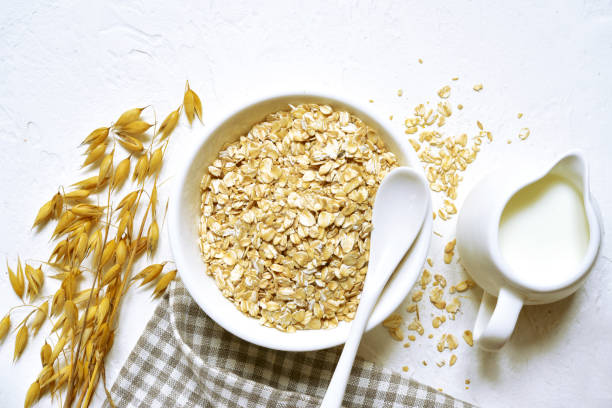 istock Raw organic oat flakes with milk 1174691629