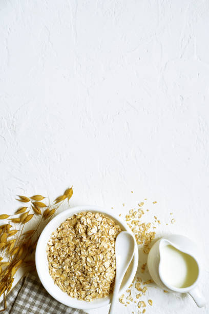 istock Raw organic oat flakes with milk 1174691696