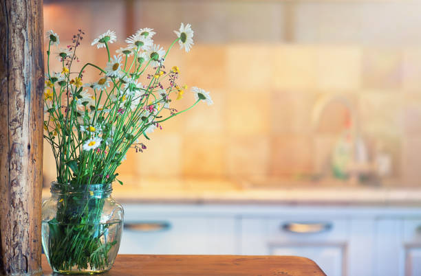 istock Chamomile Flowers in a Glass Pot 1174691777