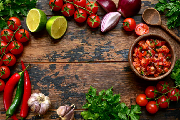 istock Tomato salsa (salsa roja) - traditional mexican sauce  with ingredients for making 1174692532