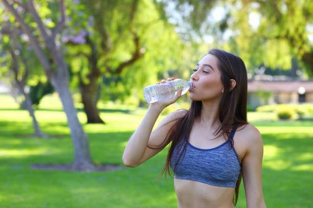 istock Woman Drinks Water After Exercise Horizontal 1174692640
