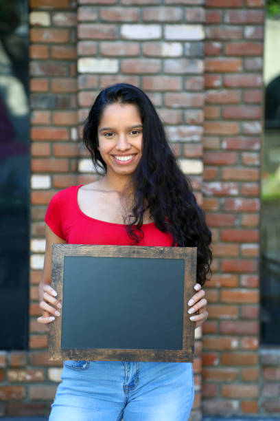 istock Woman With Blank Sign Red Top 1174692642