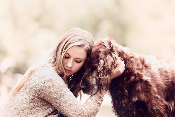 istock Young Woman Loving Her Dog 1174701881
