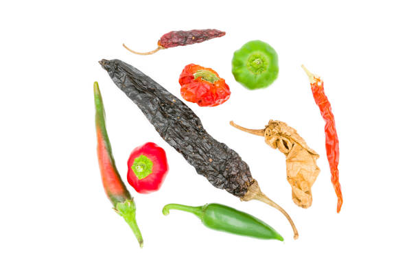 istock Chili peppers and Mexican hot peppers on white background 1174702127