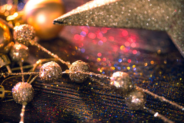 istock Shiny Christmas decorations on glitter background 1174706093