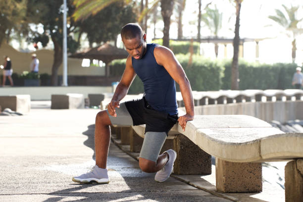istock young active african american man doing exercise outdoors 1174711995