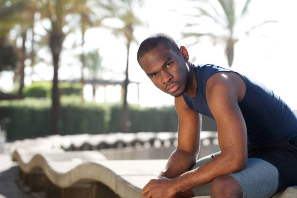 istock cool young black sports man sitting outside 1174712005