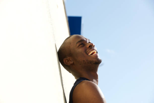 istock side portrait of young black man laughing 1174712523