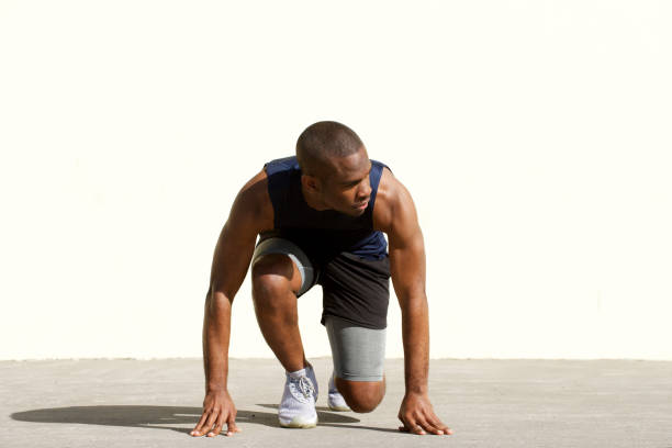 istock african american man in starting position for race 1174712532