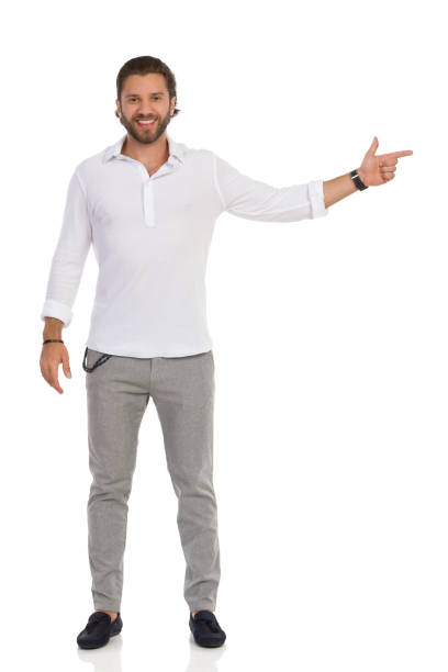 istock Elegant Handsome Man Is Pointing At The Side 1174713128