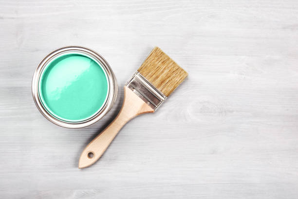istock Paint brush on the can with green paint. Top view. 1174713347
