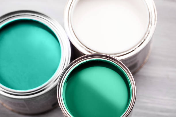 several opened cans with green paint inside. - paint home improvement paint can decorating imagens e fotografias de stock