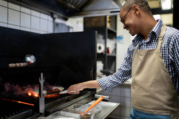 istock Chef preparing food in a commercial kitchen 1174720287