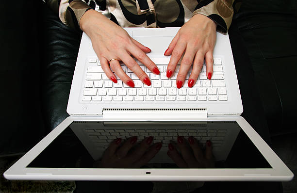 istock Womanish hands on a white laptop. 117472949