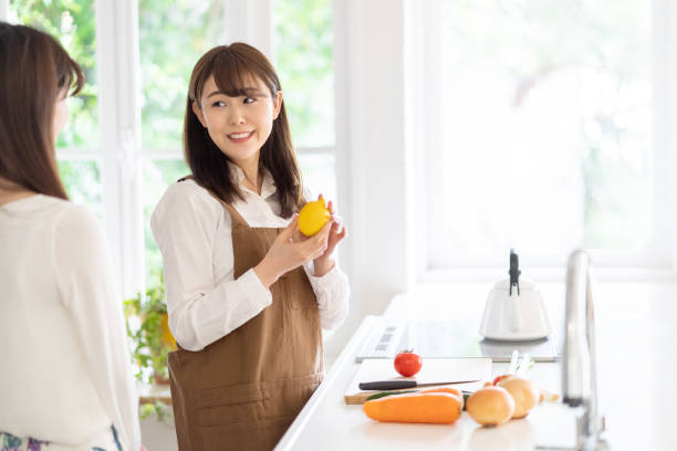 istock attractive asian women cooking in kitchen room 1174733394