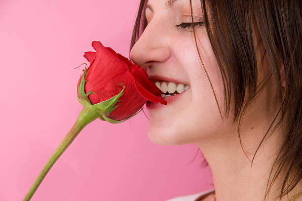 istock Young woman with rose 117473359