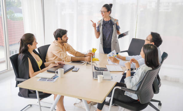istock Fin-tech and technology concept Young Portrait creative couple working success project with Business partner and wearing  casual outfit working happy action in modern Coworking space 1174736647