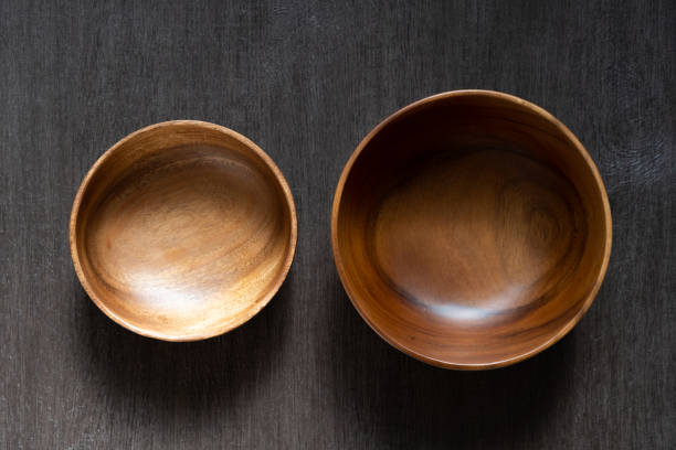 istock acacia bowl on black wooden table 1174736948