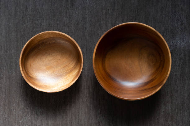 istock acacia bowl on black wooden table 1174736953