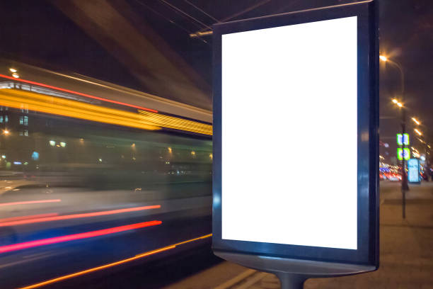 istock Blank lightbox at night with car lights in motion blur 1174743054