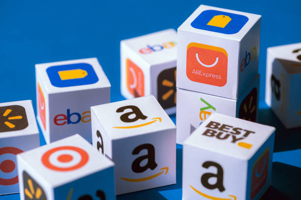Paper Boxes with eCommerce Brand Logotypes Kyiv, Ukraine - September 10, 2019: A paper cubes collection with printed logos of eCommerce corporations and online retail stores, such as AliExpress, WallMart, eBay, Amazon, and others. big tech stock pictures, royalty-free photos & images