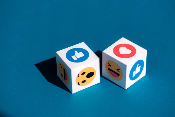 facebook emoticons printed on a cubes - telephone application software editorial symbol imagens e fotografias de stock