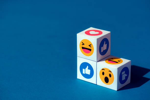Emoji Symbols from Facebook Messenger Kyiv, Ukraine - September 9, 2019: A paper cubes with printed emojis from Facebook Messenger, one of the biggest and world-famous social network. anthropomorphic smiley face photos stock pictures, royalty-free photos & images