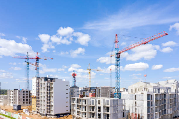 istock high building tower cranes near modern apartments under construction. aerial view 1174752796
