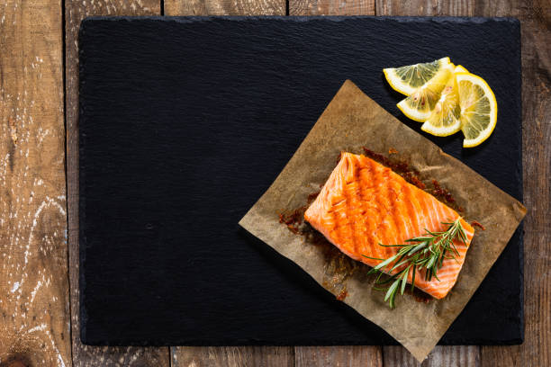istock Roasted salmon steak on stone plate 1174761291
