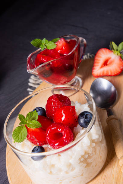 istock delicious milk rice with different berries and red fruit jelly 1174763438