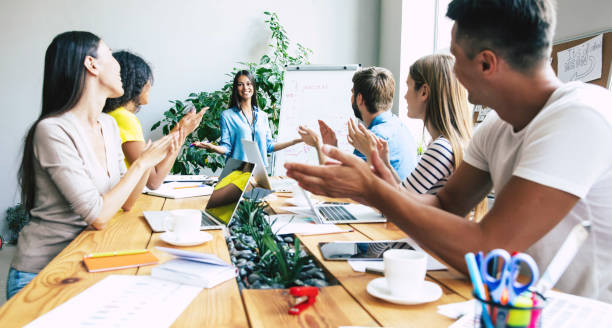 istock Successful confident modern young business man conducting a business presentation while standing in the board room. Start up team in co-working office. 1174766513