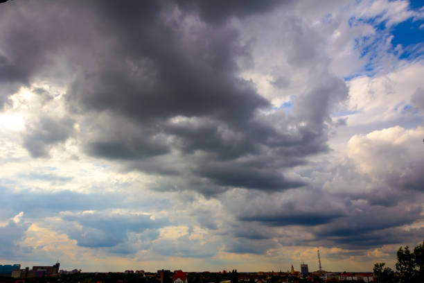 istock Rays on the blue sky with cumulus clouds 1174768625