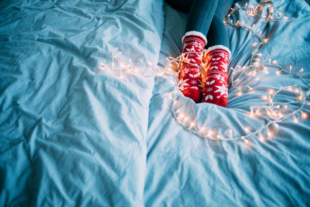 istock Woman sitting christmas socks 1174774590