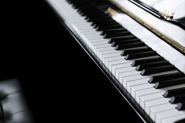 istock Piano and piano keyboard with black backgrounds. 1174777871