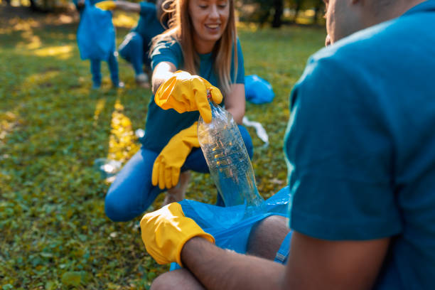 istock Young volunteers picking up trash 1174780818