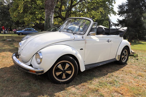 Volkswagen Beetle Karmann Edition - White color - Convertible car 2 doors - Exhibition of vintage vehicles \