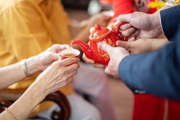 istock Newlywed serving tea to elder on Chinese traditional tea ceremony 1174782644