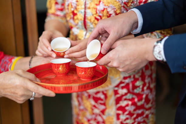 istock Newlywed serving tea to elder on Chinese traditional tea ceremony 1174782693