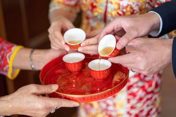 istock Newlywed serving tea to elder on Chinese traditional tea ceremony 1174782700