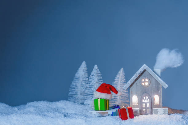 istock Christmas card with house and gifts 1174783621