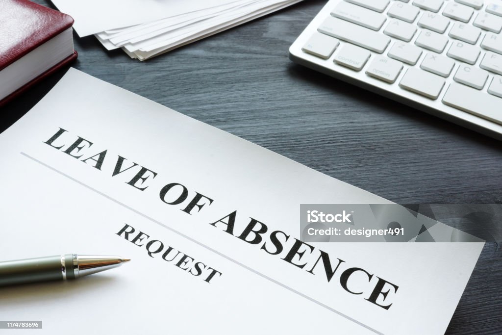Leave of absence request on the table. Leaving Stock Photo