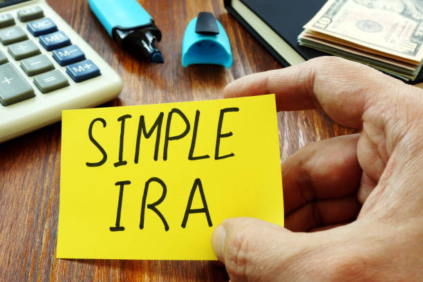 istock Simple IRA retirement plan in the hands of a man. 1174783749