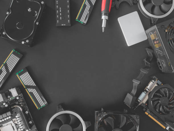istock top view of computer parts with harddisk, solid state drive, ram, CPU, graphics card, and motherboard on black table background. 1174787245