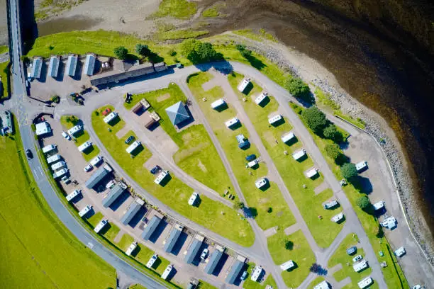 Caravan site park aerial view illuminated by summer sun at Glencoe Scotland uk